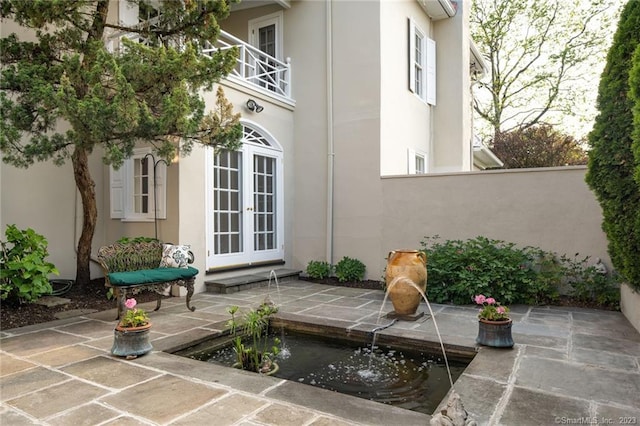 exterior space featuring french doors and a patio area