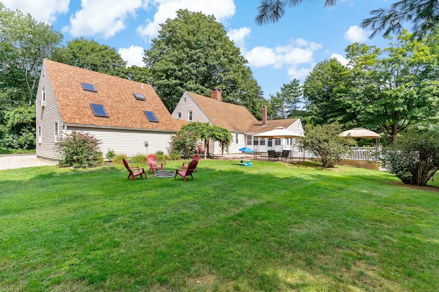 view of yard featuring an outdoor fire pit