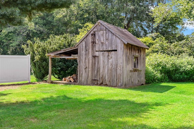 view of outdoor structure with a lawn