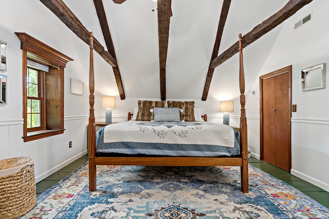 bedroom featuring beamed ceiling, high vaulted ceiling, and dark tile patterned flooring