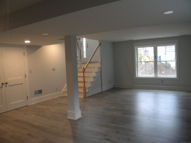 basement featuring dark hardwood / wood-style floors