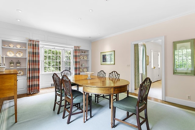 91 Open Gate Ln, Fairfield, CT 06890 - dining area featuring crown molding, light wood finished floors, built in shelves, recessed lighting, and baseboards