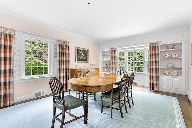 91 Open Gate Ln, Fairfield, CT 06890 - dining space featuring ornamental molding, wood finished floors, built in features, recessed lighting, and baseboards