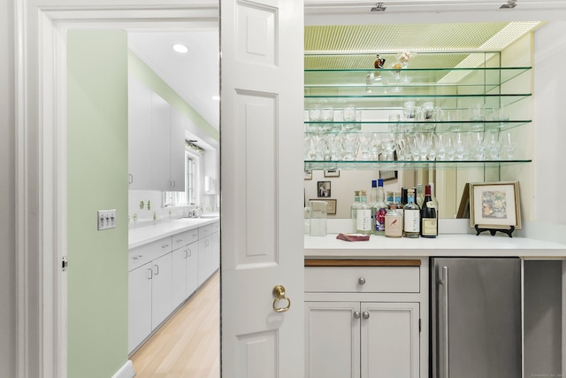 91 Open Gate Ln, Fairfield, CT 06890 - indoor dry bar featuring freestanding refrigerator, light wood finished floors, and recessed lighting