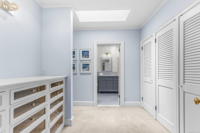 91 Open Gate Ln, Fairfield, CT 06890 - corridor featuring light carpet, ornamental molding, baseboards, and a skylight