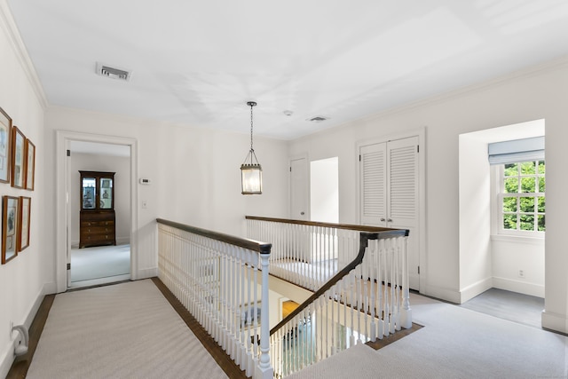 91 Open Gate Ln, Fairfield, CT 06890 - hallway with an upstairs landing, ornamental molding, and baseboards