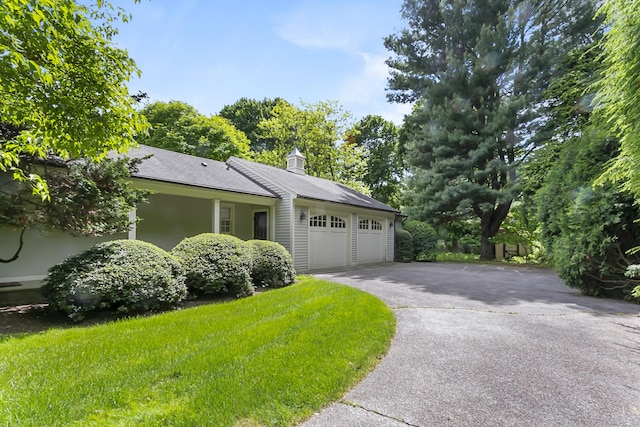 91 Open Gate Ln, Fairfield, CT 06890 - view of front of property featuring a garage, asphalt driveway, and roof with shingles