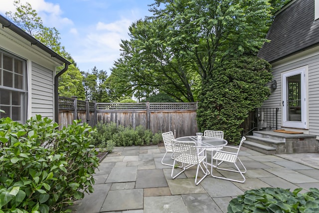 91 Open Gate Ln, Fairfield, CT 06890 - fenced backyard with a patio area and outdoor dining space