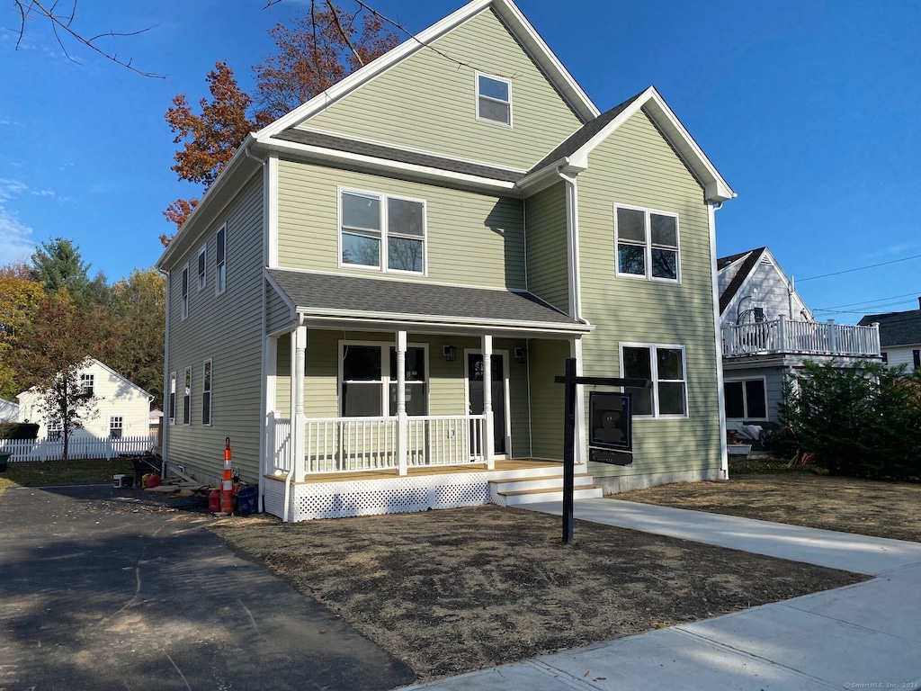 view of front property featuring covered porch