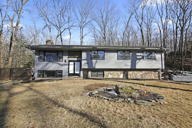 bi-level home featuring a chimney