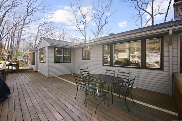 wooden terrace featuring outdoor dining space