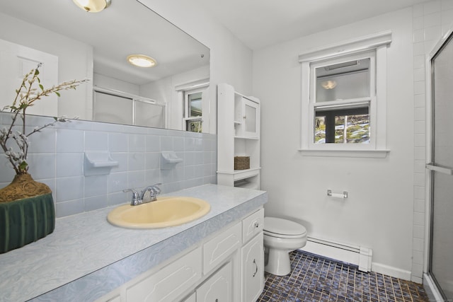 bathroom featuring vanity, a shower stall, a baseboard heating unit, toilet, and tasteful backsplash