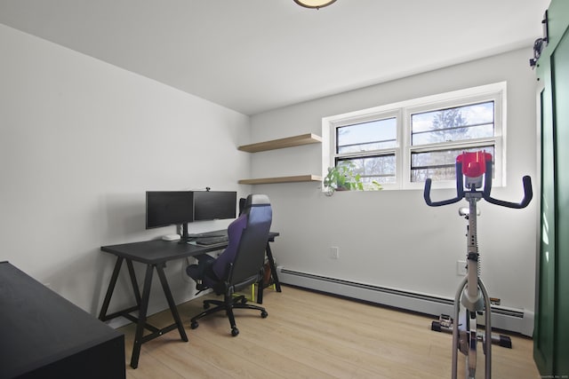 office area with light wood-type flooring and a baseboard radiator