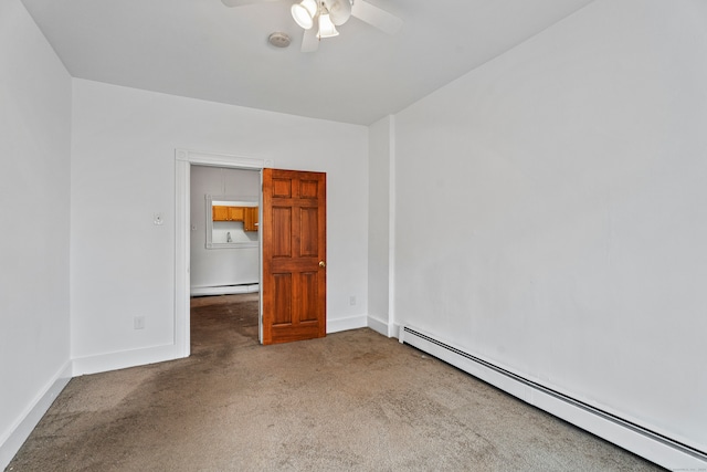 unfurnished room with ceiling fan, a baseboard radiator, and carpet flooring