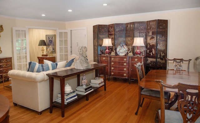 interior space featuring crown molding and light hardwood / wood-style flooring