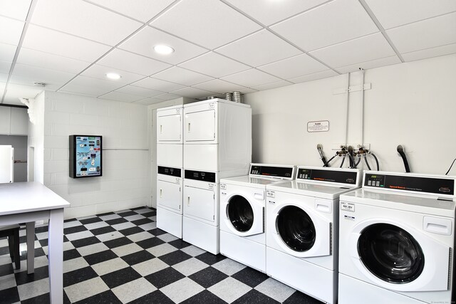 washroom with stacked washer / dryer and independent washer and dryer