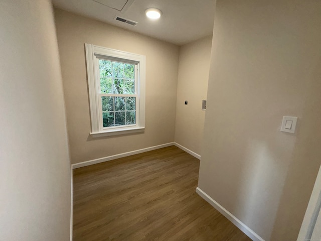 unfurnished room featuring hardwood / wood-style flooring