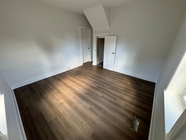 unfurnished room featuring dark hardwood / wood-style flooring