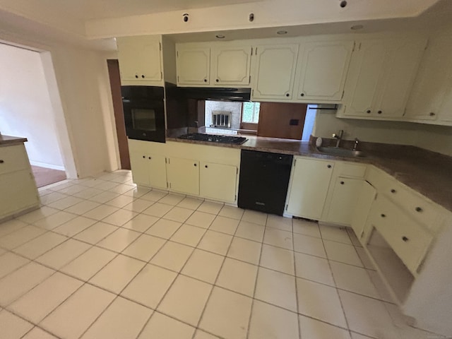 1920 Hartford Tpke, North Haven, CT 06473 - kitchen featuring light tile patterned floors, a sink, dark countertops, a peninsula, and black appliances