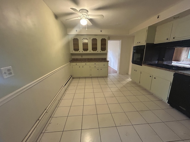 1920 Hartford Tpke, North Haven, CT 06473 - kitchen with oven, ceiling fan, light tile patterned floors, and dark countertops
