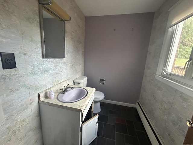 1920 Hartford Tpke, North Haven, CT 06473 - bathroom featuring vanity, baseboards, baseboard heating, and toilet