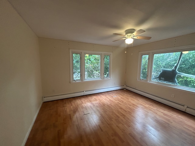 empty room with light hardwood / wood-style floors and ceiling fan