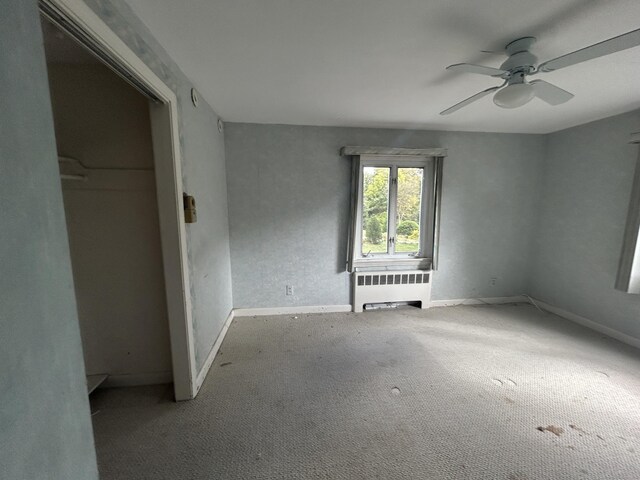 1920 Hartford Tpke, North Haven, CT 06473 - unfurnished room with carpet flooring, baseboards, a ceiling fan, and radiator