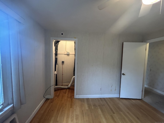 1920 Hartford Tpke, North Haven, CT 06473 - unfurnished bedroom featuring visible vents, baseboards, and wood finished floors