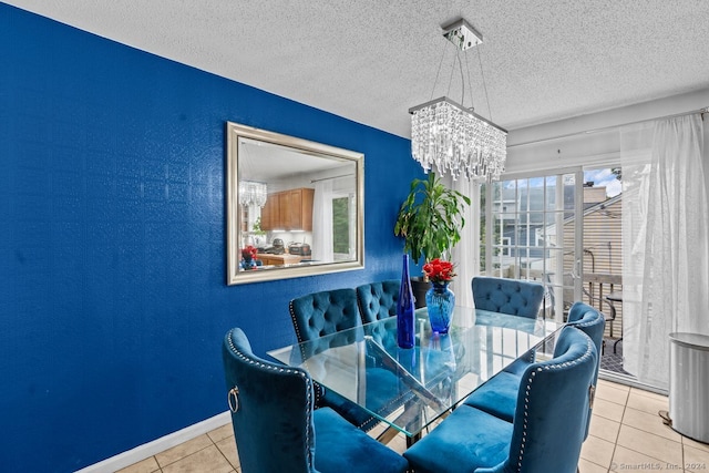 dining area featuring light tile patterned floors, a textured ceiling, and a notable chandelier