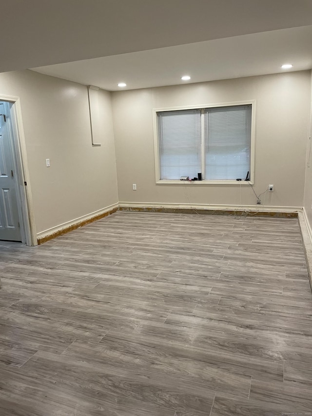 basement featuring light hardwood / wood-style flooring