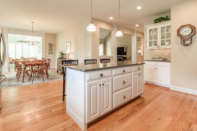 kitchen with a center island and white cabinets