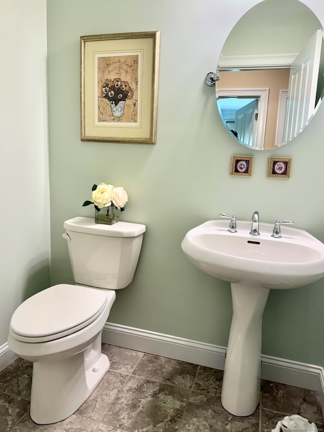 bathroom featuring toilet and sink