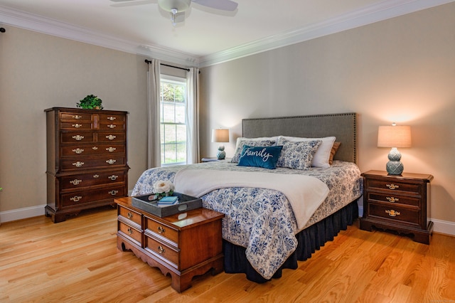 bedroom featuring ceiling fan, crown molding, and light hardwood / wood-style flooring