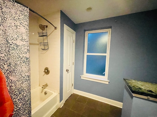 bathroom featuring tile patterned flooring and shower / bath combo