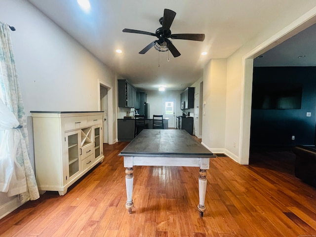 playroom with light wood-type flooring and ceiling fan