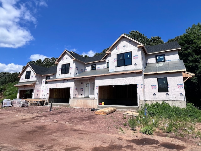 unfinished property with a garage