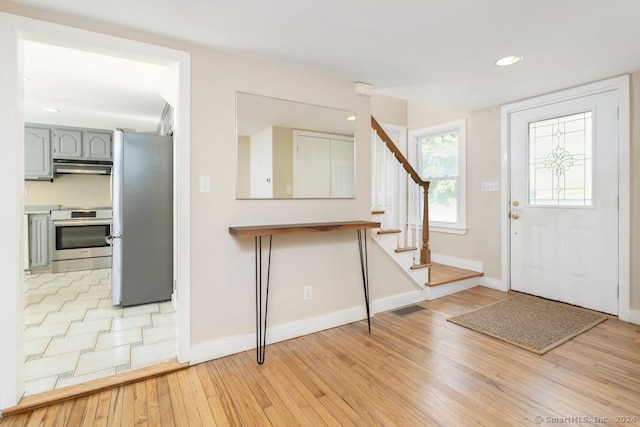 entrance foyer with light hardwood / wood-style floors