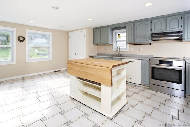 kitchen with dishwasher, sink, and stainless steel electric range