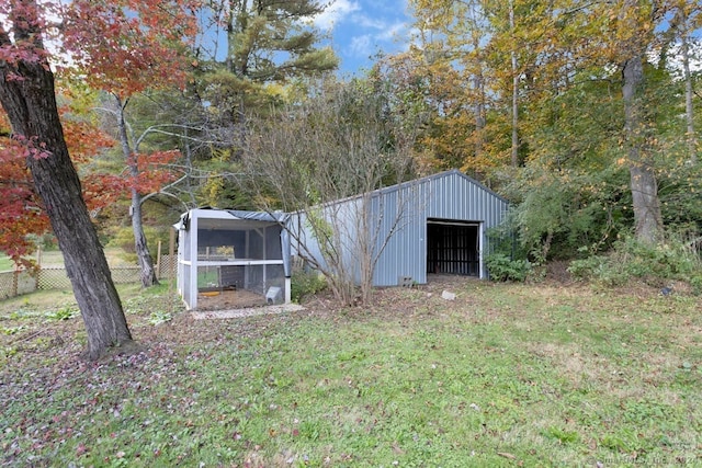 view of outbuilding with a lawn