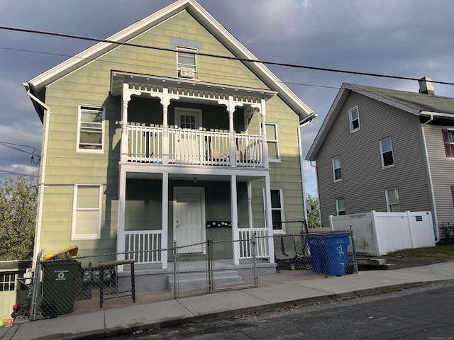 view of front of home with a balcony