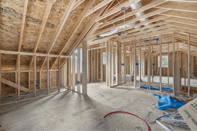 misc room featuring lofted ceiling and plenty of natural light