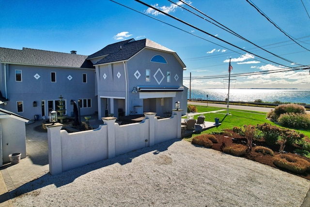 372 Maple Ave, Old Saybrook, CT 06475 - rear view of property with stucco siding and a water view