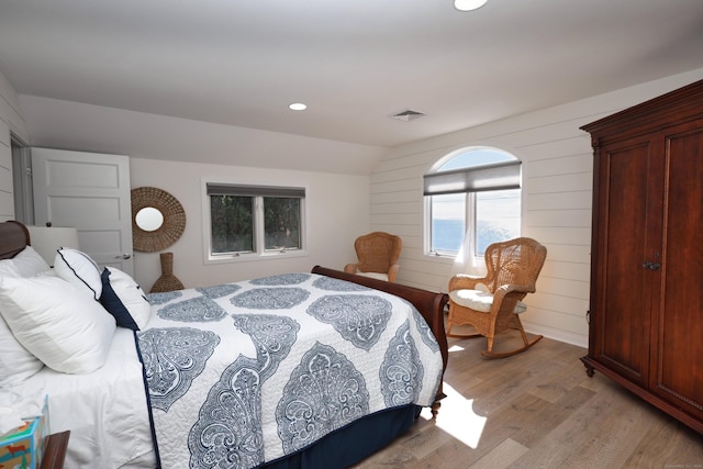 372 Maple Ave, Old Saybrook, CT 06475 - bedroom featuring light wood-type flooring, lofted ceiling, recessed lighting, and wood walls