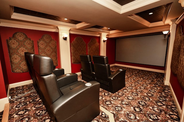 carpeted cinema room with decorative columns, ornamental molding, and coffered ceiling