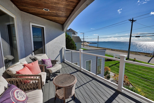 balcony featuring a water view