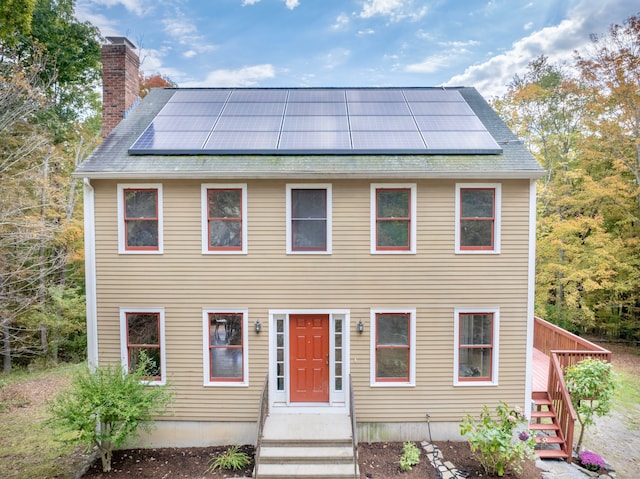 colonial house with solar panels