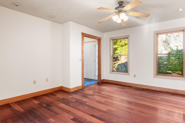 spare room featuring ceiling fan and hardwood / wood-style floors