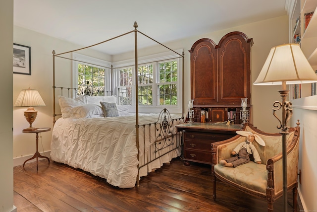 bedroom featuring dark wood-style flooring