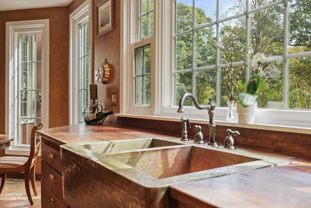 kitchen featuring light countertops and a sink