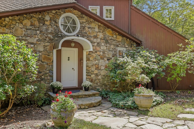 entrance to property with stone siding